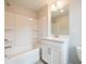 Bathroom with a white shower-tub, vanity, and toilet at 4826 Floydwood Ln, Mableton, GA 30126