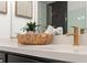 Modern bathroom featuring a white countertop, black cabinets, and stylish gold fixtures at 4826 Floydwood Ln, Mableton, GA 30126