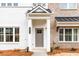 A close-up of the front exterior, showcasing the front door and brick and white paint at 4826 Floydwood Ln, Mableton, GA 30126