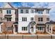 Beautiful townhome with black accents, neutral colored brick, and light colored siding with lovely curb appeal at 4826 Floydwood Ln, Mableton, GA 30126