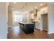 Kitchen with an island, stainless steel appliances, hardwood floors, and bright lighting at 4826 Floydwood Ln, Mableton, GA 30126