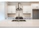 Large kitchen island featuring sink, white countertop, and stainless steel appliances at 4826 Floydwood Ln, Mableton, GA 30126