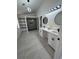 Bathroom featuring new double sink vanity, sleek lighting, and a walk in shower stall at 5055 Promenade Sw Dr, Atlanta, GA 30331