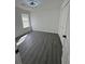 Bright bedroom with hard surface flooring, a ceiling fan and ample closet space at 5055 Promenade Sw Dr, Atlanta, GA 30331