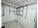 Walk-in closet with wire shelving and modern hard surface flooring at 5055 Promenade Sw Dr, Atlanta, GA 30331