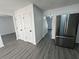 Inviting entryway featuring new floors, storage closets and modern stainless steel appliances at 5055 Promenade Sw Dr, Atlanta, GA 30331