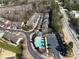 Community aerial showing residential street with homes, pool, clubhouse, and parking at 5729 Evadale Trce # 6, Mableton, GA 30126