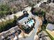 Aerial view of community pool, clubhouse, parking and the surrounding neighborhood at 5729 Evadale Trce # 6, Mableton, GA 30126