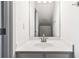 Bathroom featuring a white vanity with a sink, a mirror, and bright lighting at 5729 Evadale Trce # 6, Mableton, GA 30126