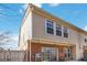 Rear exterior view featuring brick accents, siding, windows, and a view of the patio space at 5729 Evadale Trce # 6, Mableton, GA 30126