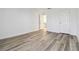 White walled room with wood look flooring and natural light coming in from an open door at 5729 Evadale Trce # 6, Mableton, GA 30126