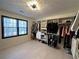 Large walk-in closet featuring custom shelving, drawers, and ample storage space, well lit with natural light at 2087 Blackberry Ln, Auburn, GA 30011