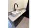 Charming laundry room with a white sink, quartz counters, and dark wood cabinets at 2087 Blackberry Ln, Auburn, GA 30011