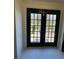 Doors that lead out to a wooden deck overlooking the green grass and trees at 2087 Blackberry Ln, Auburn, GA 30011