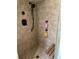 Shower featuring bronze tiles and a wooden bench at 2087 Blackberry Ln, Auburn, GA 30011