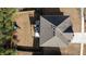 Aerial view showcasing the property's roof, spacious backyard, fence, deck, patio area and playground equipment at 784 Sunset Down Ct, Loganville, GA 30052