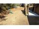 Spacious backyard features a playset, wood fence, and a deck with stairs leading to the patio at 784 Sunset Down Ct, Loganville, GA 30052