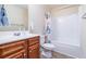 Full bathroom features a shower-tub combination and wooden vanity at 784 Sunset Down Ct, Loganville, GA 30052