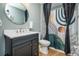 Stylish bathroom with a marble vanity and a modern shower curtain; provides a spa-like retreat at 784 Sunset Down Ct, Loganville, GA 30052