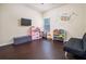 Spacious bedroom featuring hardwood floors and room for play at 784 Sunset Down Ct, Loganville, GA 30052