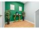 Inviting entryway featuring a green accent wall, console table, and decor at 784 Sunset Down Ct, Loganville, GA 30052