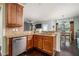 Open kitchen with stainless steel appliances, granite countertops, a breakfast bar, and dark wood floors at 784 Sunset Down Ct, Loganville, GA 30052
