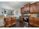 Beautiful kitchen with stainless steel appliances, granite countertops, and dark wood cabinetry at 784 Sunset Down Ct, Loganville, GA 30052