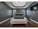 Spacious main bedroom with dark walls, decorative ceiling, and a large bed at 784 Sunset Down Ct, Loganville, GA 30052