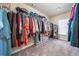 Spacious walk-in closet with ample hanging space and organizational shelves at 784 Sunset Down Ct, Loganville, GA 30052