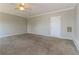 Neutral bedroom with plush carpeting, white trim, and a ceiling fan at 1935 Cutters Mill Way, Lithonia, GA 30058
