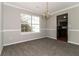 Dining room with plush carpeting, chandelier, and a large window at 1935 Cutters Mill Way, Lithonia, GA 30058