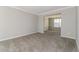 Bright living room with neutral walls, plush carpeting, and an open layout at 1935 Cutters Mill Way, Lithonia, GA 30058