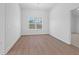 Well-lit dining room with hardwood floors and a large window at 1209 Cedarcrest Blvd, Acworth, GA 30101