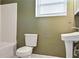 Bathroom with a window and a pedestal sink at 2670 Foxlair Trl, Atlanta, GA 30349