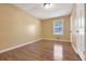 Bedroom with hardwood floors and a double window at 2670 Foxlair Trl, Atlanta, GA 30349