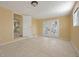 Sunny bedroom with tile flooring, natural light, and access to the backyard at 2670 Foxlair Trl, Atlanta, GA 30349