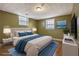 Staged bedroom features a queen bed and a blue rug at 2670 Foxlair Trl, Atlanta, GA 30349