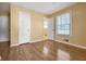 Bedroom featuring hardwood flooring and a double window at 2670 Foxlair Trl, Atlanta, GA 30349