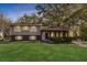 Charming split-level home with brick facade, landscaped front yard, and covered porch at 2670 Foxlair Trl, Atlanta, GA 30349