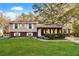 Charming split-level home with brick facade, landscaped front yard, and covered porch at 2670 Foxlair Trl, Atlanta, GA 30349