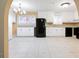 Bright kitchen with white cabinets, granite countertops, and black appliances at 2670 Foxlair Trl, Atlanta, GA 30349