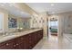 Spacious bathroom featuring dual sinks, granite countertops, and a separate glass-enclosed shower at 2950 Mount Wilkinson Se Pkwy # 712, Atlanta, GA 30339
