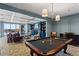 Resident game room featuring a billiards table, comfortable seating, and scenic skyline views at 2950 Mount Wilkinson Se Pkwy # 712, Atlanta, GA 30339