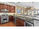 Modern kitchen featuring stainless steel appliances, granite countertops, and custom cabinetry at 2950 Mount Wilkinson Se Pkwy # 712, Atlanta, GA 30339