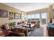 Bright living room with comfortable seating, hardwood floors, and a stunning city view from the balcony at 2950 Mount Wilkinson Se Pkwy # 712, Atlanta, GA 30339