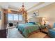 Luxurious main bedroom with a chandelier, balcony access, and ample natural light at 2950 Mount Wilkinson Se Pkwy # 712, Atlanta, GA 30339