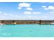 Stunning infinity pool overlooking scenic skyline with lounge chairs for residents to enjoy at 2950 Mount Wilkinson Se Pkwy # 712, Atlanta, GA 30339