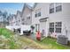 Charming backyard with patio, outdoor seating, and a stylish outdoor fireplace feature at 6730 Gallant Se Ct, Mableton, GA 30126
