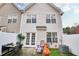 Charming backyard featuring a patio, outdoor seating, and a decorative outdoor fireplace at 6730 Gallant Se Ct, Mableton, GA 30126