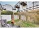 Fenced backyard with patio seating area, retaining wall, and space for outdoor activities, perfect for relaxation at 6730 Gallant Se Ct, Mableton, GA 30126